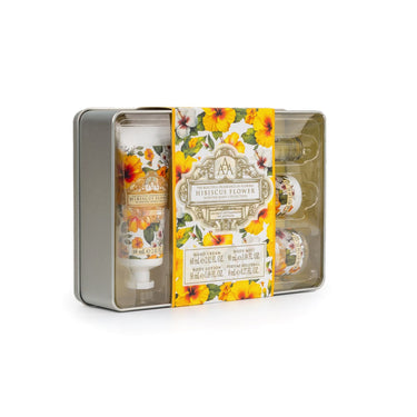 Gift set with body lotion and floral packaging on a white background