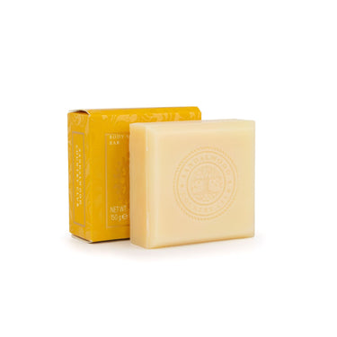 Bar of soap with a yellow box on a white background