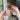 Two RHS soap bars held by hands in front of a door.